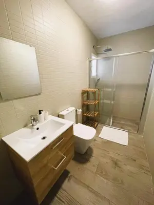 a hallway with a mirror and a wall with a wallpaper at Alojamiento Rural Buenavista in Arcos de la Frontera