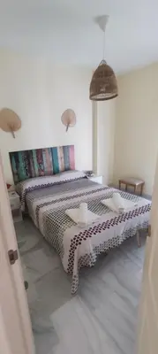 a bedroom with a large bed in a room at Costa Ballena!!! House on Mediterranean Coast with pool and golf!!! Dúplex!!! in Costa Ballena