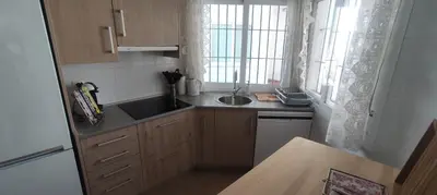 a small kitchen with a sink and a window at Costa Ballena!!! House on Mediterranean Coast with pool and golf!!! Dúplex!!! in Costa Ballena