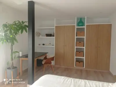 a bedroom with a desk and a table and a bed at VILLA SANTA CLARA in Chiclana de la Frontera