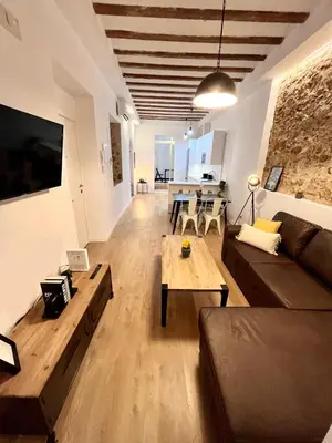 a living room with a couch and a table at GATU PREMIUM Villa La Pepa in Cádiz
