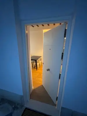 a door leading into a room with a table at GATU PREMIUM Villa La Pepa in Cádiz