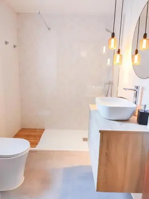 a bathroom with a white toilet and a sink at Apartamento Sol y Sal in Chiclana de la Frontera