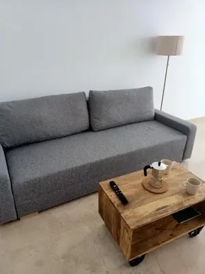 a living room with a couch and a coffee table at Azvalia - Larga 112 in El Puerto de Santa María