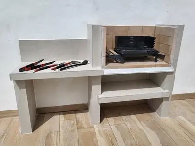 a wooden cabinet with some knives in it at Villa Romadian in Chiclana de la Frontera