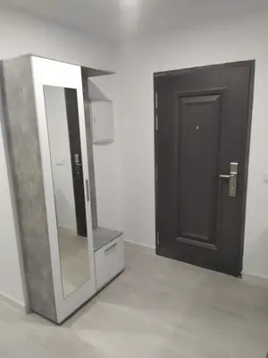 a bathroom with a mirror next to a door at Villa Romadian in Chiclana de la Frontera