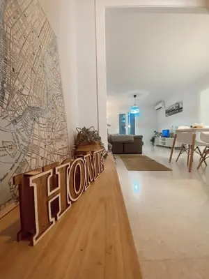 a living room with a large mural on the wall at Texas Life Apartamento Centro Jerez in Jerez de la Frontera