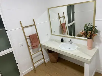 a bathroom with a sink and a mirror at Azvalia - Puro Puerto Casco Histórico in El Puerto de Santa María