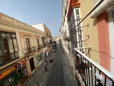 an empty street in an alley between buildings at Azvalia - Puro Puerto Casco Histórico in El Puerto de Santa María