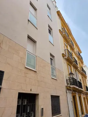 a tall building with windows on the side of it at Hercules in Cádiz