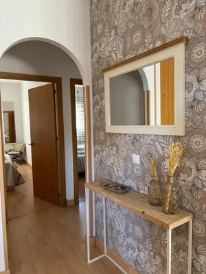 a room with a mirror on a wall at El Mirador de Inés - Primera Línea de Playa in El Puerto de Santa María