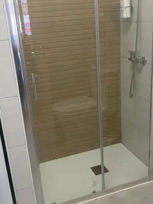 a shower with a glass door in a bathroom at LA VENDIMIA in Jerez de la Frontera