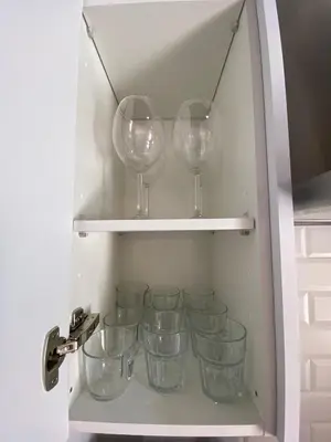 a bunch of glasses sitting on a shelf at LA VENDIMIA in Jerez de la Frontera