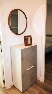 a mirror on a wall above a dresser in a room at Apartamento Luz de Sanlúcar in Sanlúcar de Barrameda
