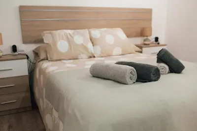 a bedroom with a bed with two pillows on it at Apartamento 