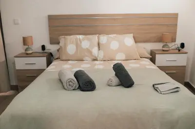 a bedroom with a bed with pillows on it at Apartamento 