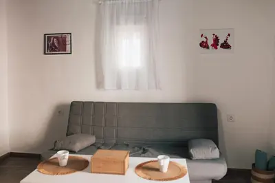 a living room with a couch and a table at Apartamento 