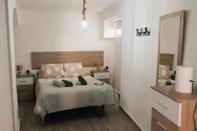 a bedroom with a bed with two pillows on it at Apartamento 