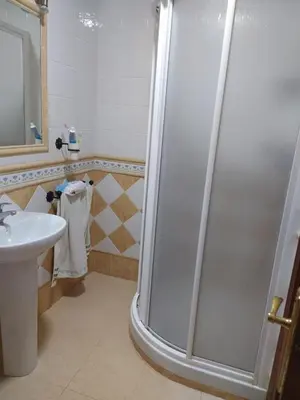 a bathroom with a shower and a sink at Apartamento grumete in El Puerto de Santa María
