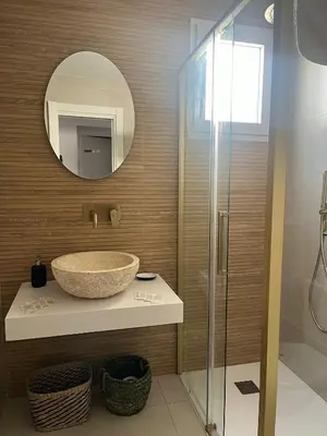a bathroom with a sink and a mirror at Hidden Gem Penthouse El Mesón in Cádiz