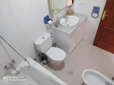 a bathroom with a toilet and a sink and a tub at Casa playa Bajo de Guía-Centro in Sanlúcar de Barrameda