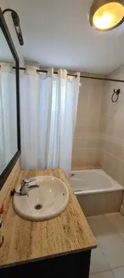 a bathroom with a sink and a bath tub at La Casita de Guía by Sanlúcar Housing in Sanlúcar de Barrameda