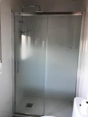 a shower with a glass door in a bathroom at las camelias in El Puerto de Santa María