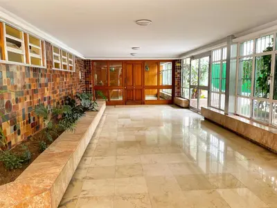 an empty hallway in a building with windows at Eva Recommends Francos in Jerez de la Frontera
