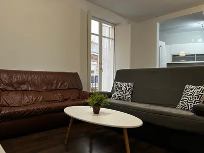 a living room with a couch and a table at Casa Ayuntamiento Ascensor Grupo AC Gestion in Cádiz