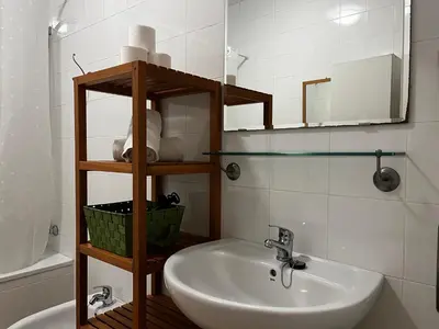 a bathroom with a sink and a mirror at Casa Ayuntamiento Ascensor Grupo AC Gestion in Cádiz
