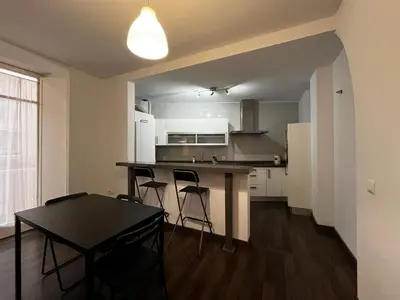 a kitchen with a table and chairs in a room at Casa Ayuntamiento Ascensor Grupo AC Gestion in Cádiz