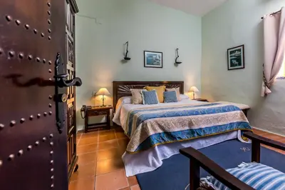 a bedroom with a bed in a room at Hacienda El Santiscal in Arcos de la Frontera