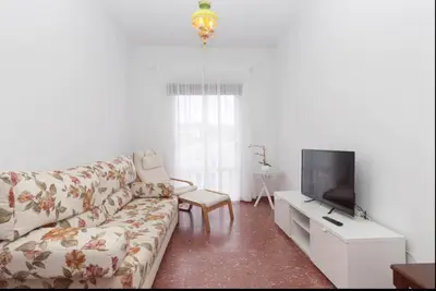 a living room with a couch and a tv at Precioso y luminoso apartamento Calle Corredera. Casco Histórico in Arcos de la Frontera