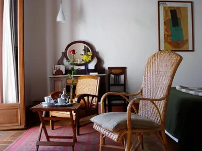 a room with two chairs and a table and a mirror at La Casa Grande in Arcos de la Frontera