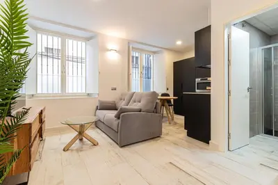a living room with a couch and a table at Allo Apartments San Roque Bajo A in Cádiz