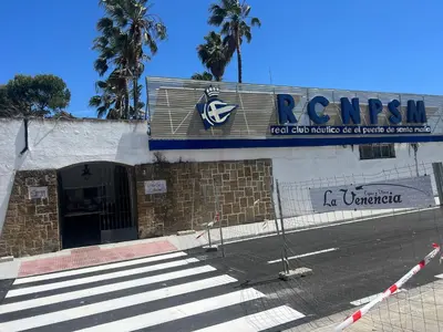 a building with a sign on the side of a street at Velero en el corazón de El Puerto de Santa María in El Puerto de Santa María