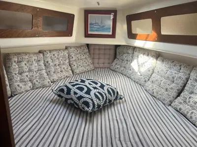 a large bed in the back of a motor boat at Velero en el corazón de El Puerto de Santa María in El Puerto de Santa María