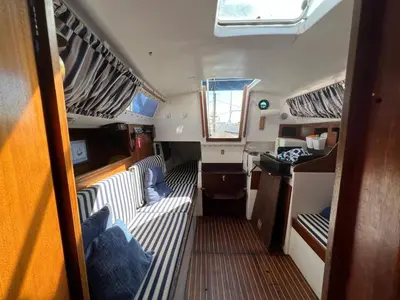 an interior view of an rv with beds and a window at Velero en el corazón de El Puerto de Santa María in El Puerto de Santa María