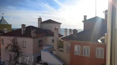 a view from a window of a building with roofs at Magnífico piso en la playa in El Puerto de Santa María