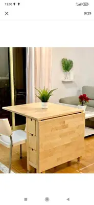 a wooden desk with two plants on top of it at Valdelagrana vista al mar Puerto de Santa María in El Puerto de Santa María