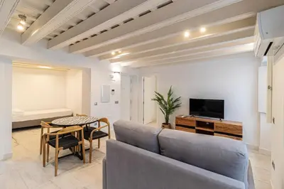 a living room with a couch and a table at Allo Apartments San Roque 1ºA in Cádiz