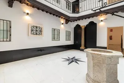 a large room with a stone pillar in the middle at Allo Apartments San Roque 1ºA in Cádiz
