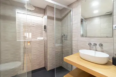 a bathroom with a sink and a shower at Allo Apartments San Roque 1ºB in Cádiz