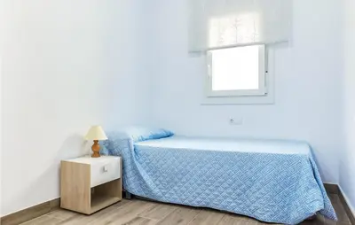 a small bedroom with a bed and a window at 3 Bedroom Amazing Apartment In Cadiz in Cádiz