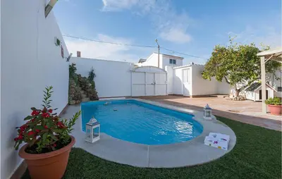 a swimming pool in the yard of a house at Stunning Home In San Jose Del Valle in San Jose del Valle