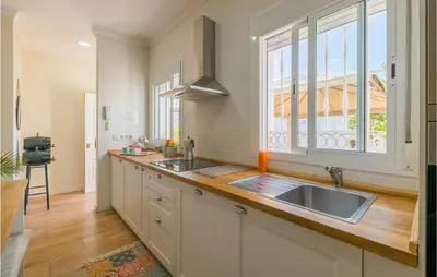 a kitchen with a sink and a window at Stunning Home In San Jose Del Valle in San Jose del Valle