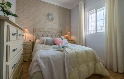 a bedroom with a bed with a teddy bear on it at Stunning Home In San Jose Del Valle in San Jose del Valle