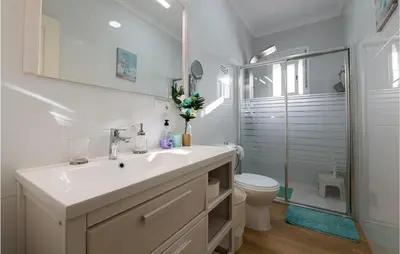 a white bathroom with a sink and a shower at Stunning Home In San Jose Del Valle in San Jose del Valle