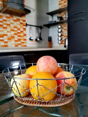 a bowl of fruit on a counter in a kitchen at La Casita del Arte in Cádiz