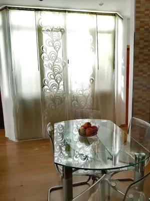 a glass table with a bowl of fruit on it at La Casita del Arte in Cádiz